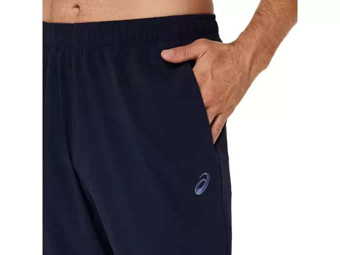 Calça de tecido ASICS com bordado espiral Calça de tecido ASICS com bordado espiral