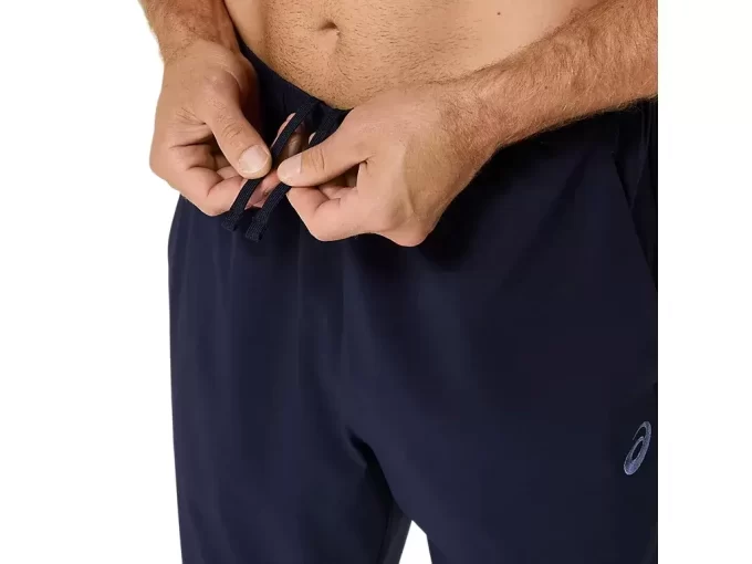 Calça de tecido ASICS com bordado espiral Calça de tecido ASICS com bordado espiral