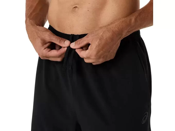 Calça de tecido ASICS com bordado espiral Calça de tecido ASICS com bordado espiral